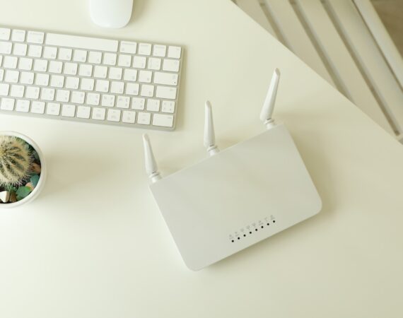 Workplace with Wi - fi router on white table