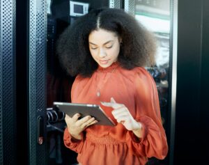 Information technology, programming and black woman with tablet in hand to check server. Technology