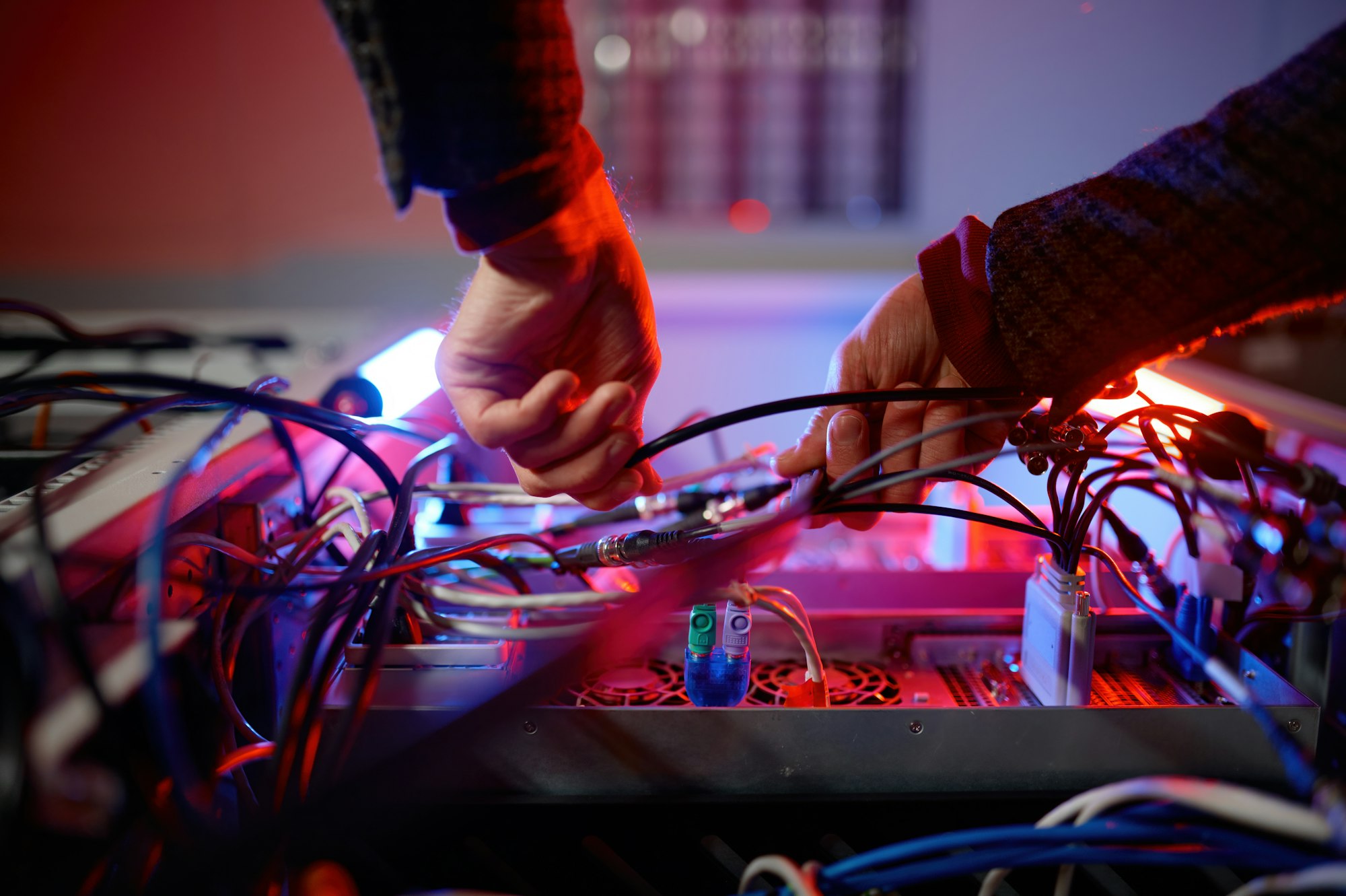 Closeup hand of it technician working with cable and wire